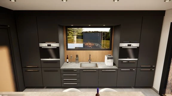 Vue d’un espace intérieur avec cuisine, salle à manger et salon ouverts