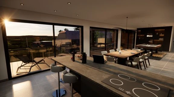 Vue d’un espace intérieur avec cuisine, salle à manger et salon ouverts