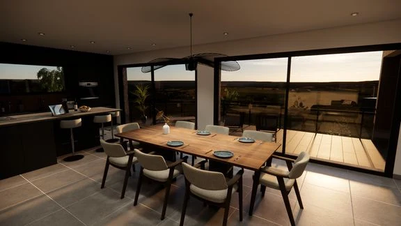 Vue d’un espace intérieur avec cuisine, salle à manger et salon ouverts