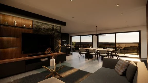 Vue d’un espace intérieur avec cuisine, salle à manger et salon ouverts