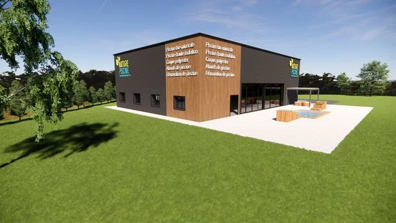 Bâtiment professionnel à bardage sombre et bois, avec accès et stationnement