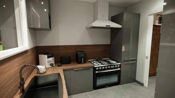 Cuisine avec meubles blancs, plan de travail en bois et four